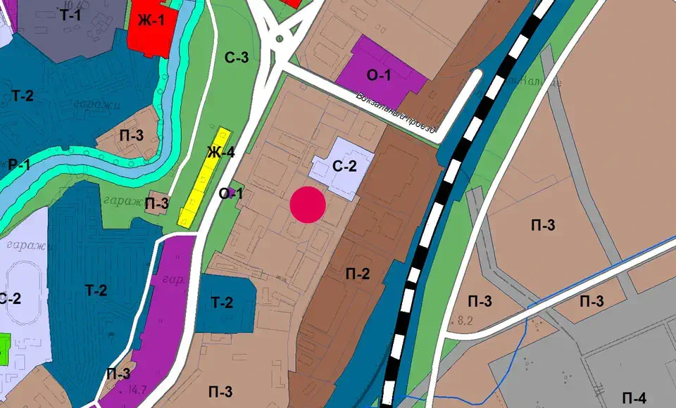 На рисунке показано место расположения промышленного здания (алое пятно в центре рисунка) в пределах карты градостроительного зонирования